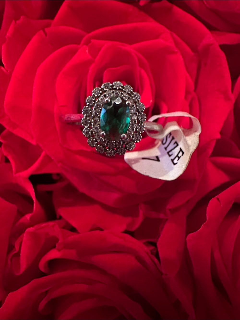 Emerald Green Halo Ring with Clear Accent Stones